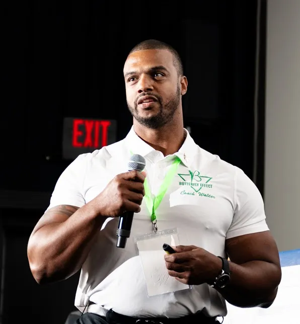 Coach Walter Sellers speaking to a group