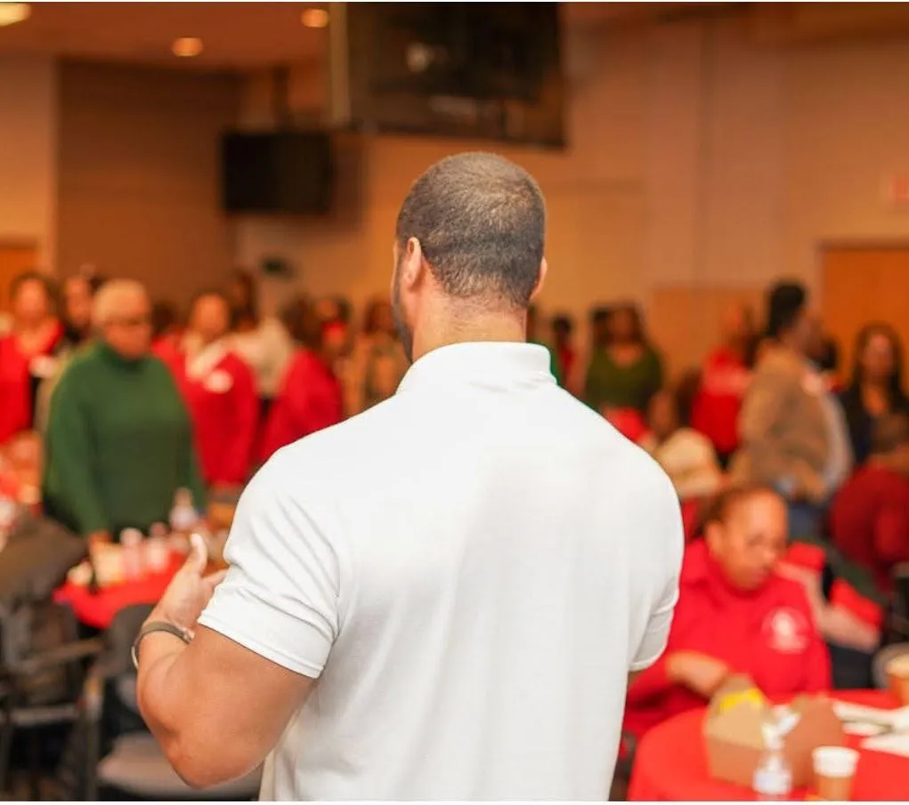 Coach leading a workplace wellness event